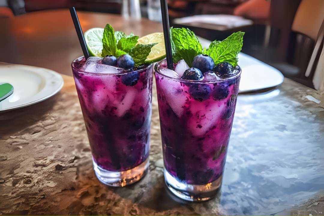 If you’re looking for a refreshing and vibrant drink that’s perfect for any occasion, the Blueberry Basil Lemon Lavender Mocktail is the way to go. This non-alcoholic drink combines the sweet and tart flavors of fresh blueberries with the earthy taste of basil, a touch of floral lavender, and the zesty kick of lemon. It’s the ultimate drink to wow your guests while keeping things light and refreshing.