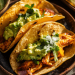 Crockpot Crispy Chicken Tinga Tacos with Avocado Jalapeño Crema