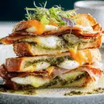 pesto eggs and crispy mortadella sandwich on toasted ciabatta