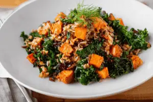 Caramelized Sweet Potato and Kale Fried Wild Rice served with vinaigrette