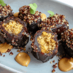 Fresh quinoa crunch stuffed dates with peanut butter and chocolate.