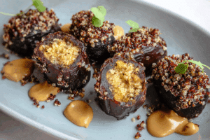 Fresh quinoa crunch stuffed dates with peanut butter and chocolate.