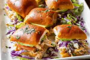 Shredded rotisserie chicken sliders fresh from oven