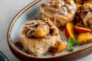 peach cobbler cinnamon rolls fresh out of the oven