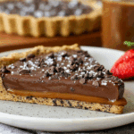 Chocolate Chip Salted Caramel Tart slice showing caramel and chocolate layers