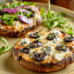 Golden-baked Portobello Mushroom Pizzas with toppings.