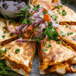 Freshly cooked BBQ Chicken Quesadillas in a warm kitchen setting
