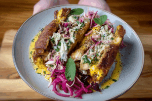 Curried Chicken Lime Coleslaw and Mint Yoghurt sandwich close-up