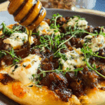 Sausage Ricotta Honey Hot Pizza with hot honey drizzle and basil