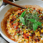 Creamy tomato risotto with roasted corn and herbs