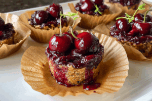 Homemade peanut butter cherry chia jam cups on a wooden table