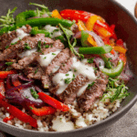 Philly Cheesesteak Bowl with beef, peppers, onions, and cheese sauce