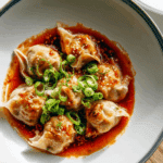 Chicken Wontons in Spicy Chili Sauce