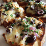 Ninita’s Cheesy Olive Crostini