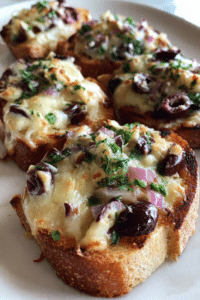 Ninita’s Cheesy Olive Crostini