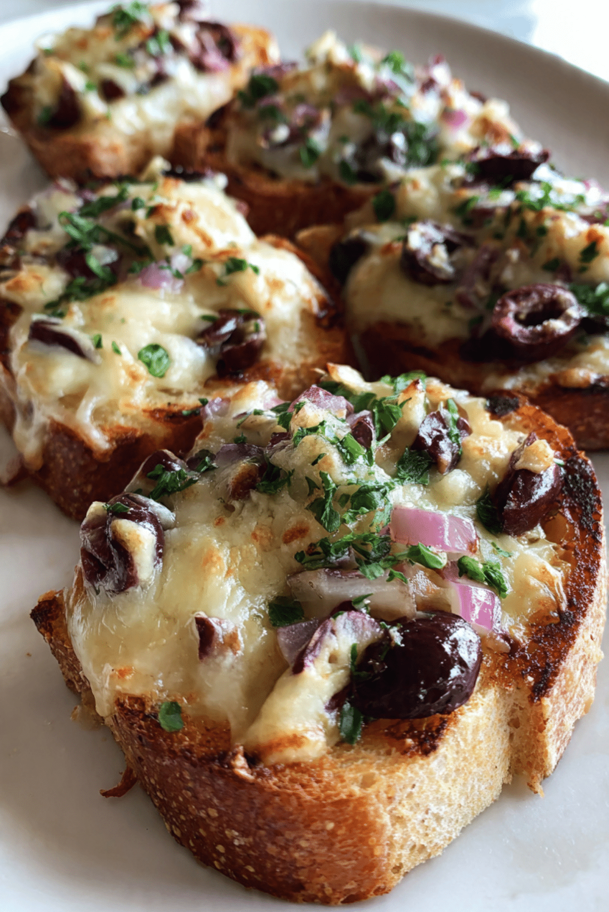 Ninita’s Cheesy Olive Crostini