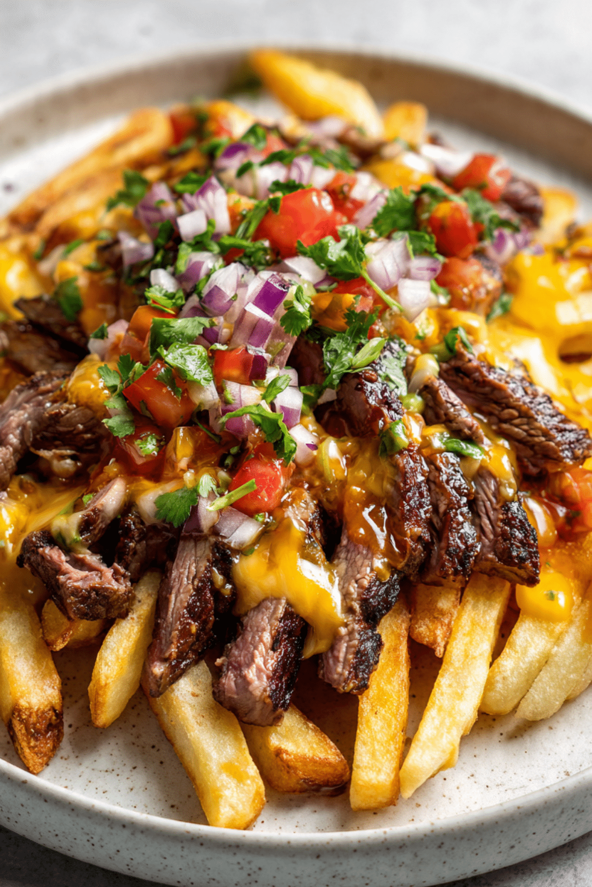 Carne Asada Fries With Sliced Steak and Chile Butter Sauce